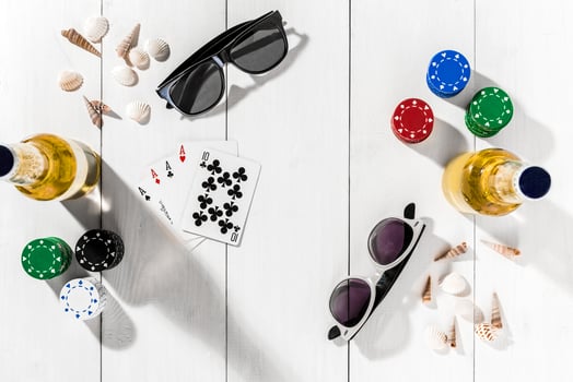 Gambling. Poker chips, cards and two bottles of beer on wooden table. Top view. Copyspace. Poker photo