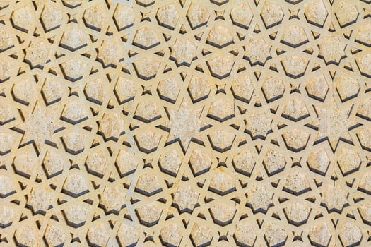 Colorful vintage surface with an old oriental pattern. The background is a texture that has a decorative value. For overlay or texture designs photo