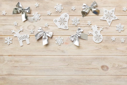 New Year composition white christmas snowflakes. Christmas decor background with pine cones. Top view with copy space photo