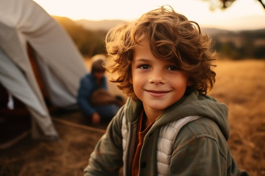 Portrait of a cute boy looking at camera while near his tent in nature AI generated photo