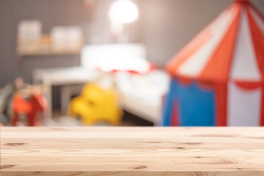 Wood foreground with blur kid children bedroom blur background for advertising display montage products photo