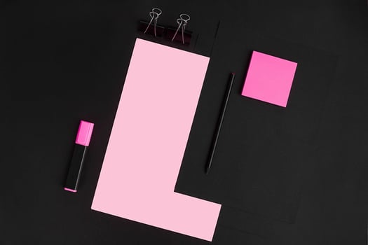 Top view of office supplies on blackboard background with copy space. photo