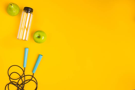 Top view of Skipping rope on yellow background photo