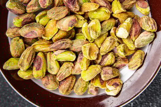 pistachios peeled nut healthy eating cooking appetizer meal food snack on the table copy space food background rustic top view photo