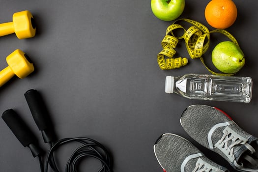 Workout plan with fitness food and equipment on gray background, top view photo