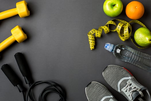 Workout plan with fitness food and equipment on gray background, top view photo