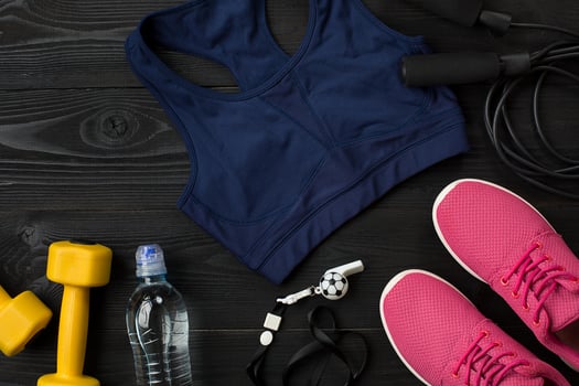 Workout plan with fitness food and equipment on dark background, top view photo