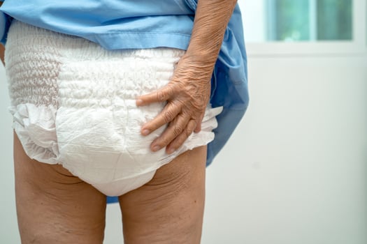 Asian senior woman patient wearing incontinence diaper in hospital, healthy strong medical concept. photo