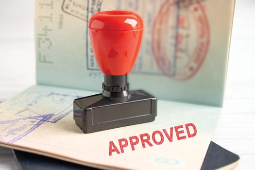 Approved Stamp visa and passport document to immigration at airport in country. photo