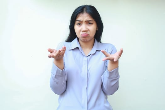 uncertain beautiful asian woman looking at camera and raising hand with open palm have no idea gesture, questioning answer, doubtful decision, isolated on white background wear formal suit photo