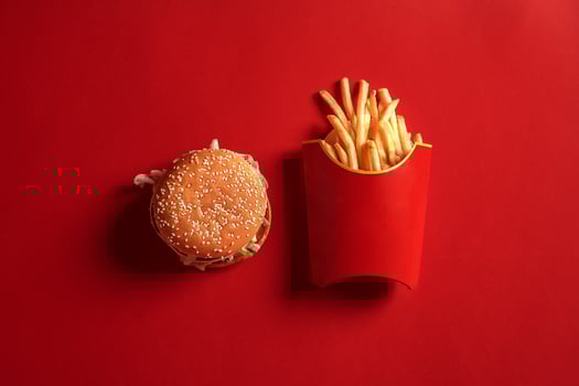Concept of mock up burger and french fries on red background. Copy space for text and logo. photo