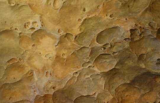 Combination of stone relief like a orange planet surface. Brown stone with abnormal relief shape photo