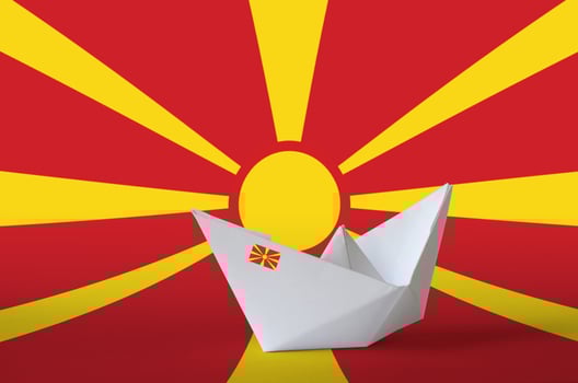 Macedonia flag depicted on paper origami ship closeup. Handmade arts concept photo
