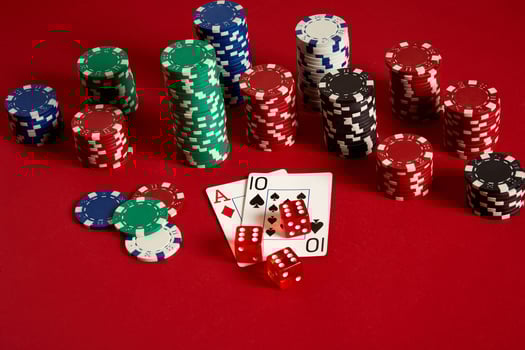 Poker cards and gambling chips on red background photo