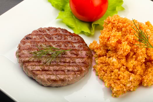 Burger cutlet over wooden background photo