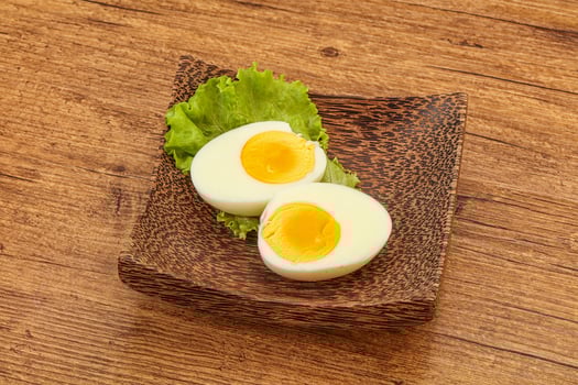 Boiled egg slices in the bowl photo