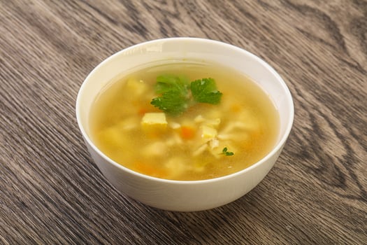 Tasty chicken soup with carrot photo