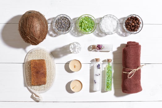 Composition of spa treatment on white wooden table with space for text. Top view photo