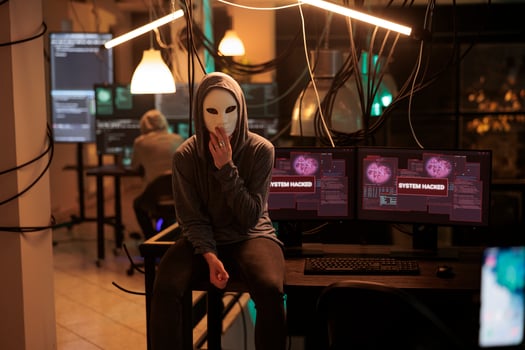 Anonymous hacking computer system, breaking into online server, attacking database. Cybercrime, woman hacker stealing information, programming malware software portrait at night time photo