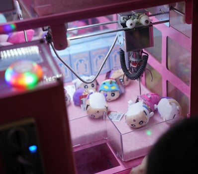 doll claw vender game arcade photo