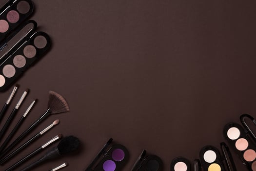 The women's cosmetics set on a brown background, modern woman. photo