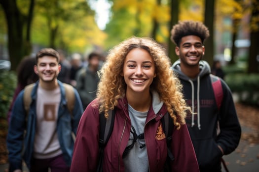 Happy college kids walking photo