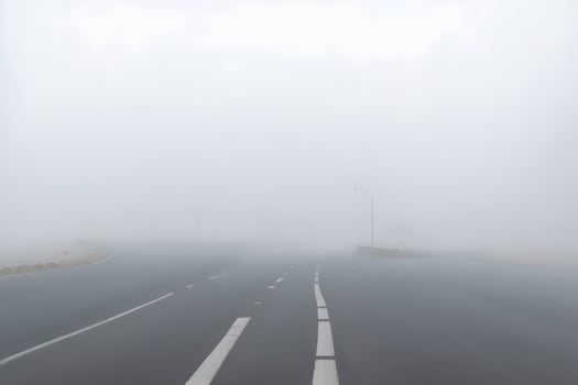 Empty city road covered in fog, misty asphalt road on a winter morning generated by Ai photo