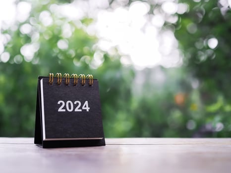 Close up 2024 desk calendar on the table with copy space. Resolution, Goal, Action, Planning, and manage to success business. photo