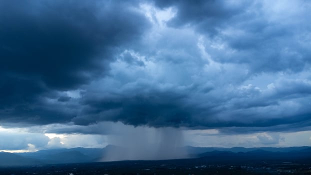 Aerial panoramic view of community and farmland with huge storm clouds in the background. Aerial view of the rain over a rural community. Rain clouds shot from a drone. photo