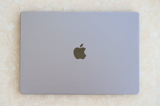KYIV, UKRAINE - 4 MAY, 2023 Cover view of MacBook Air MacBook Pro 13 in space gray color isolated on white background photo