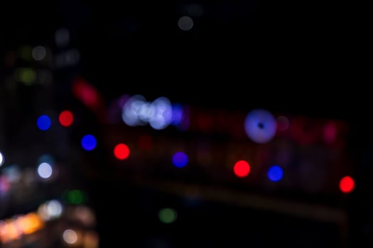 Night city street abstract blurry bokeh lights background photo