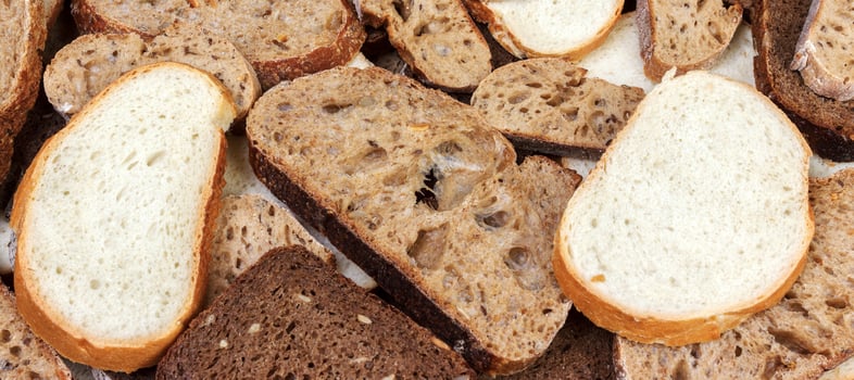 Sliced white and brown loaf of bread photo