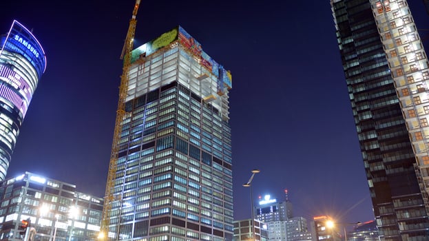 Pattern of office buildings windows illuminated at night. Glass architecture ,corporate building at night - business concept. photo