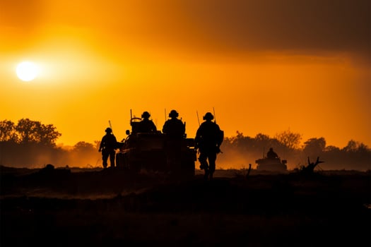Soldiers silhouettes in the foggy sunset, surrounded by fire and smoke AI Generated photo