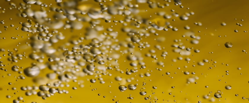 Golden Hyaluron Oil bubbles collagen serum or yellow oil bubbles drop texture background photo
