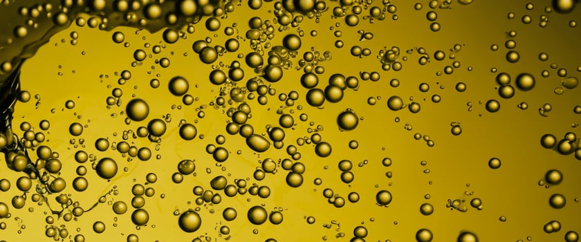 Golden Hyaluron Oil bubbles collagen serum or yellow oil bubbles drop texture background photo