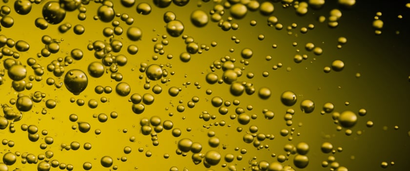 Golden Hyaluron Oil bubbles collagen serum or yellow oil bubbles drop texture background photo
