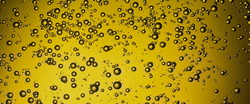 Golden Hyaluron Oil bubbles collagen serum or yellow oil bubbles drop texture background photo