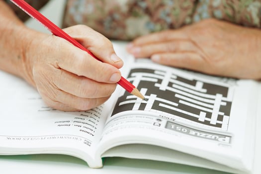 Bangkok, Thailand - May 15, 2022 elderly woman playing sudoku puzzle game for treatment dementia prevention and Alzheimer disease. photo