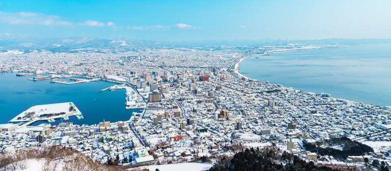 Beautiful landscape and cityscape from Hakodate Mountain with Snow in winter season. landmark and popular for attractions in Hokkaido, Japan.Travel and Vacation concept photo
