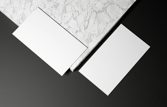 Business card on marble and black background photo