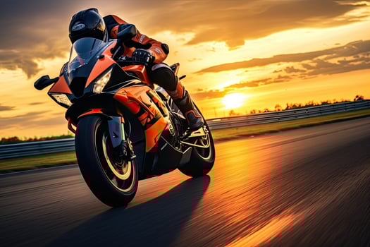 Motorcycle rider rides on the race track at sunset or sunrise, Motorcycle rider on sport bike rides fast on race track at sunset. Extreme athlete Sport Motorcycles Racing, AI Generated photo