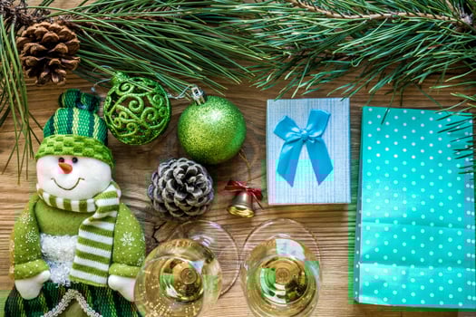 New Year's holiday with spruce branches and with a pair of wine glasses of champagne. Flat lay, top view, copy space photo