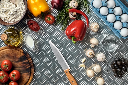 Cooking Pizza. Pizza ingredients on the iron table with copy space, top view. photo