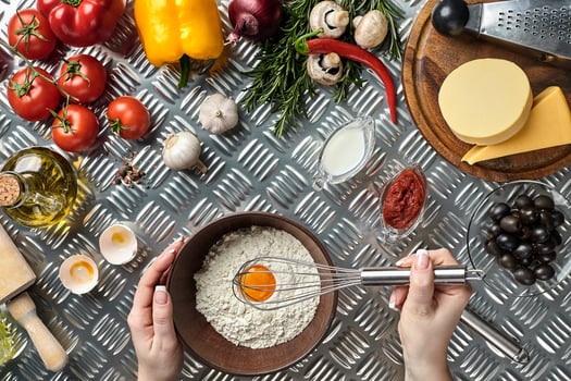 Young woman cooking in kitchen, closeup photo