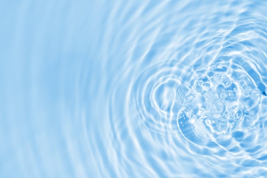 Abstract transparent water shadow surface texture natural ripple on blue background photo