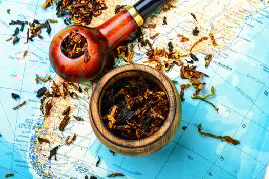 Tobacco pipe on the map photo