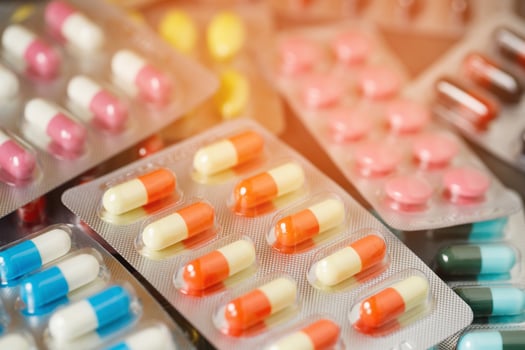 close up pharmaceuticals antibiotics pills medicine in blister packs. colorful antibacterials pills Pharmacy background. capsule pill medicine Antimicrobial drug resistance. Pharmaceutical industry photo