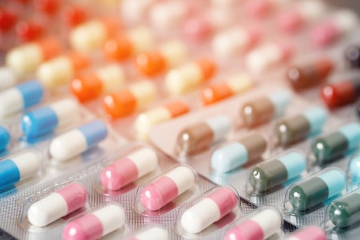 close up pharmaceuticals antibiotics pills medicine in blister packs. colorful antibacterials pills Pharmacy background. capsule pill medicine Antimicrobial drug resistance. Pharmaceutical industry photo