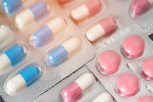 close up pharmaceuticals antibiotics pills medicine in blister packs. colorful antibacterials pills Pharmacy background. capsule pill medicine Antimicrobial drug resistance. Pharmaceutical industry photo